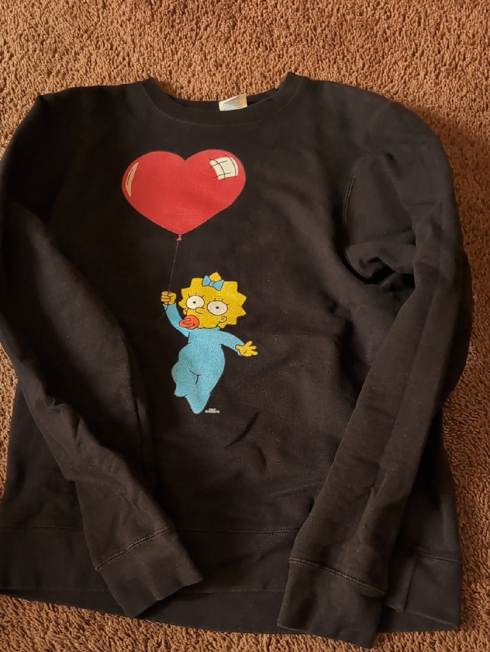 Black Sweatshirt with Maggie Simpson Heart Balloon Graphic
